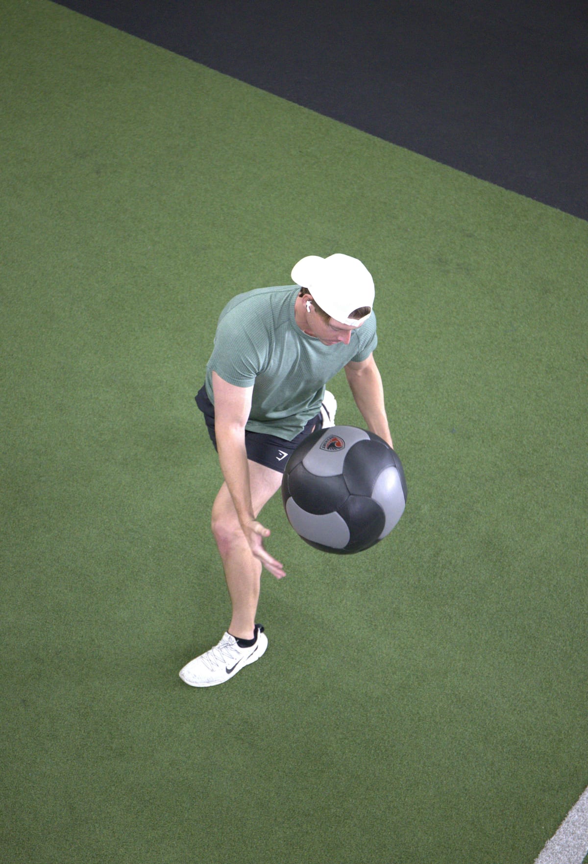 Golf Fit athlete driving into an explosive medicine-ball slam to generate power