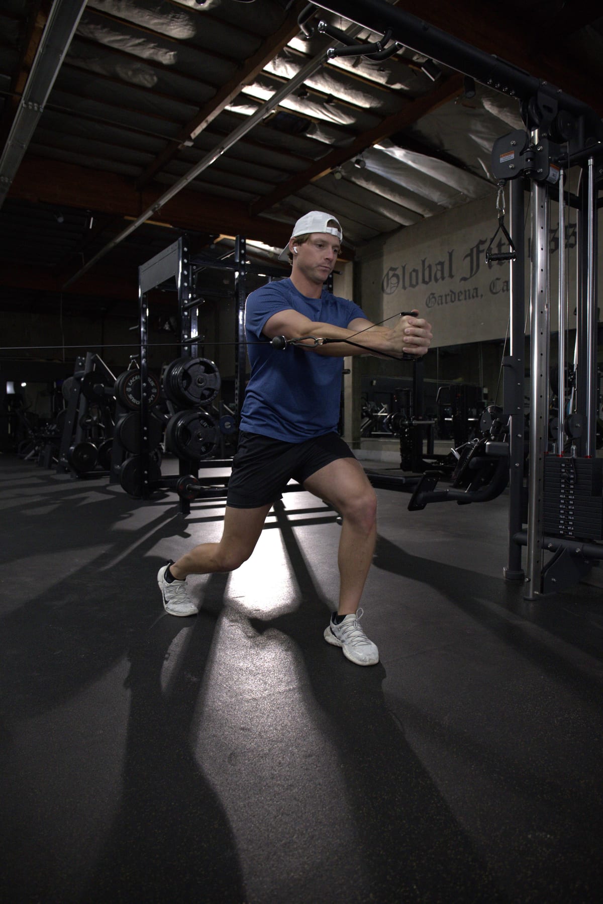 Golf Fit athlete performing a single-leg cable rotation to build turn and separation